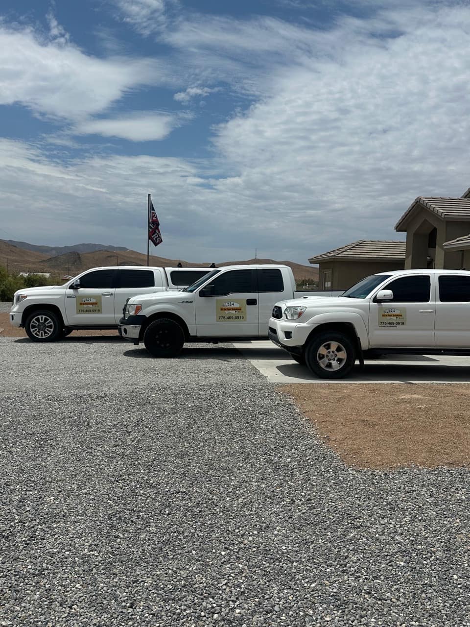All In Pest Solutions service trucks lined up at a job serving the Las Vegas valley